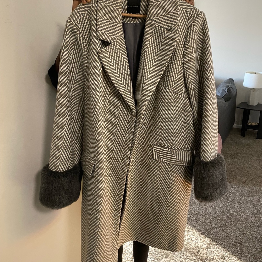 Winter jacket with faux fur wrist sleeves.